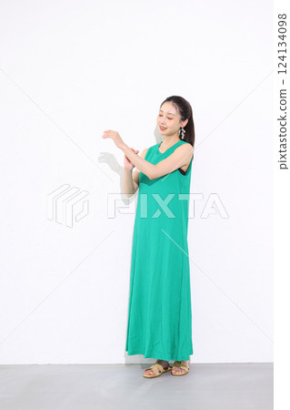Woman in green dress Woman in green dress 124134098