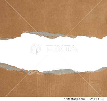 Torn edges of brown paper on a white background, space for writing. Copy space 124134130