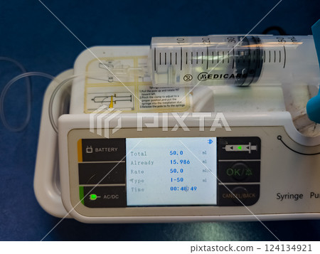 Simple infusion pump for medical use with digital display in operation Simple infusion pump for medical use with digital display in operation 124134921