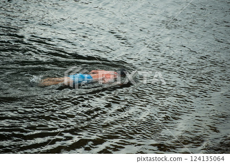 portrait of man swimming in the Rhine river Carried by the current portrait of man swimming in the Rhine river Carried by the current 124135064
