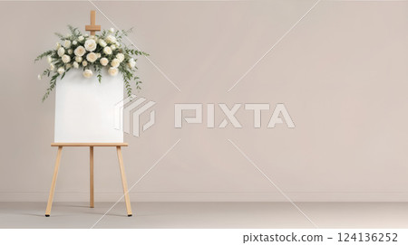 A wooden easel with a white board and flowers arranged on it 124136252