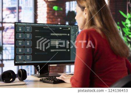 Adult types prompts on a PC to receive AI generated responses, working from home using artificial intelligence for efficiency. Advanced chatbot demonstrates efficient support and automation. 124136453