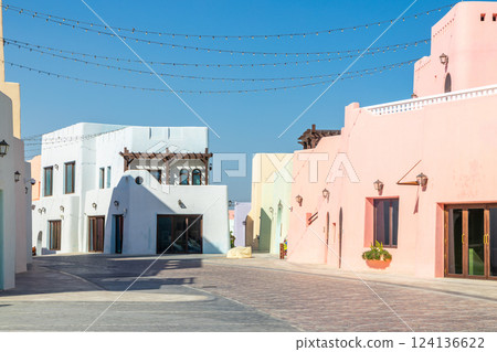 Colorful Mina village district street with arab traditional shaped buildings, Doha, Qatar 124136622