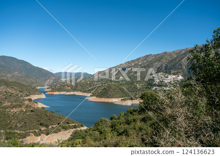 Panoramic view of mediterranean landscape with mountains and river under clear blue sky, La Panoramic view of mediterranean landscape with mountains and river under clear blue sky, La 124136623
