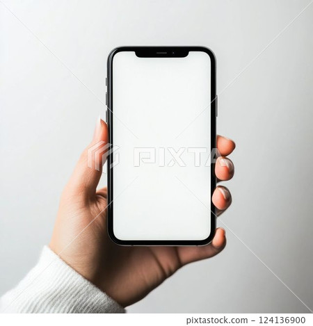 Woman's hand holding a smartphone 124136900