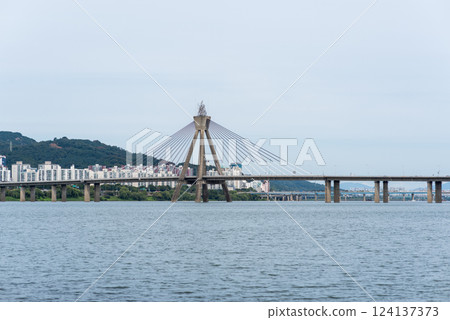 Grand Olympic Bridge, in the shape of the Olympic torch, over the Han River in Seoul, capital of South Korea Grand Olympic Bridge, in the shape of the Olympic torch, over the Han River in Seoul, capital of South Korea 124137373