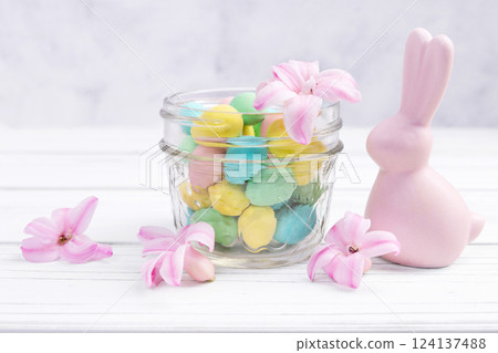 Easter bunny, jar with sweet eggs and hyacinth flowers. Easter bunny, jar with sweet eggs and hyacinth flowers. 124137488