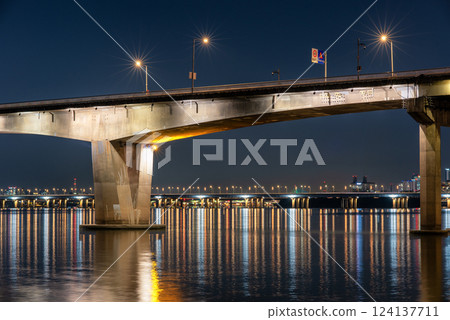 Night view of Han river Hangang and urban cityscape of Seoul, capital of South Korea Night view of Han river Hangang and urban cityscape of Seoul, capital of South Korea 124137711