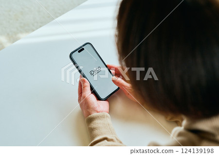 Senior woman using smartphone iDeCo Senior woman using smartphone iDeCo 124139198