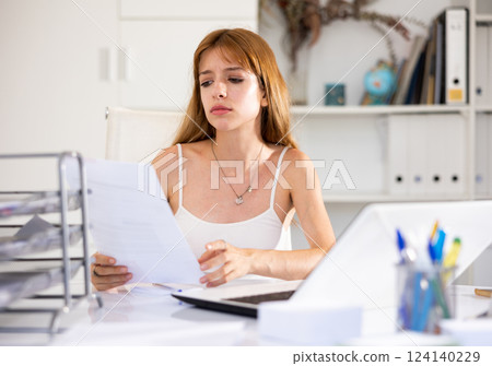 Angry female manager experiencing emotions in modern office Angry female manager experiencing emotions in modern office 124140229