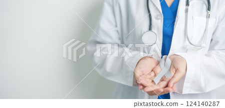 Brain Cancer Awareness May month, Doctor with grey color Ribbon for supporting life people. Healthcare and World cancer day concept Brain Cancer Awareness May month, Doctor with grey color Ribbon for supporting life people. Healthcare and World cancer day concept 124140287