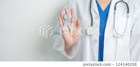 Brain Cancer Awareness May month, Doctor with grey color Ribbon for supporting life people. Healthcare and World cancer day concept Brain Cancer Awareness May month, Doctor with grey color Ribbon for supporting life people. Healthcare and World cancer day concept 124140288