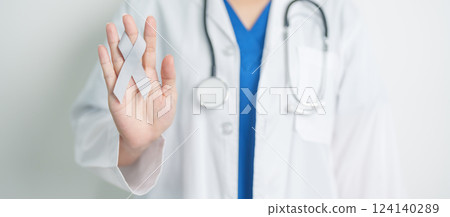 Brain Cancer Awareness May month, Doctor with grey color Ribbon for supporting life people. Healthcare and World cancer day concept Brain Cancer Awareness May month, Doctor with grey color Ribbon for supporting life people. Healthcare and World cancer day concept 124140289