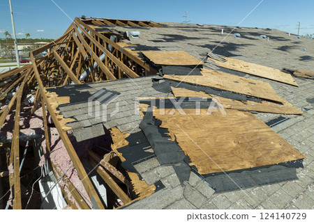 Hurricane Ian destroyed house roof in Florida residential area. Natural disaster and its consequences Hurricane Ian destroyed house roof in Florida residential area. Natural disaster and its consequences 124140729