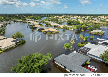 Hurricane Debby tropical rainstorm flooded residential homes and cars in suburban community in Sarasota, Florida. Aftermath of natural disaster 124140733
