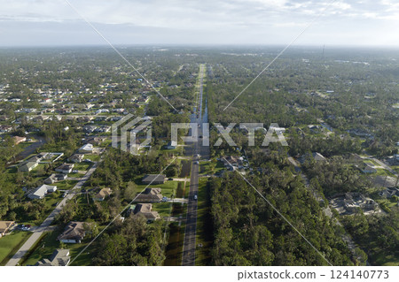 Heavy flood with high water surrounding residential houses after hurricane rainfall in Florida residential area. Consequences of natural disaster Heavy flood with high water surrounding residential houses after hurricane rainfall in Florida residential area. Consequences of natural disaster 124140773