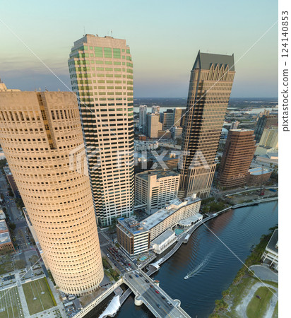 Evening urban landscape of downtown district of Tampa in Florida, USA. American city skyline with brightly illuminated high commercial buildings and streets Evening urban landscape of downtown district of Tampa in Florida, USA. American city skyline with brightly illuminated high commercial buildings and streets 124140853