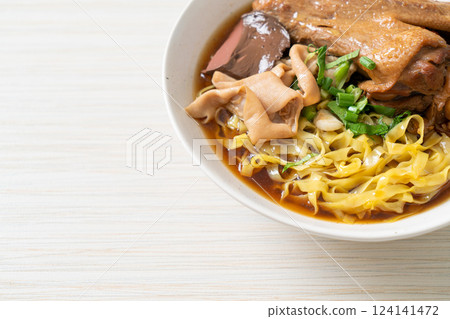 egg noodles with stewed and braised duck in brown soup egg noodles with stewed and braised duck in brown soup 124141472