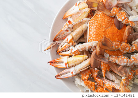 Steamed blue crab with spicy seafood sauce Steamed blue crab with spicy seafood sauce 124141481