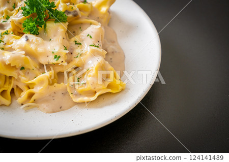tortellini pasta with mushroom cream sauce and cheese tortellini pasta with mushroom cream sauce and cheese 124141489