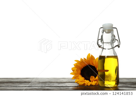 PNG, Oil in glass bottle and sunflower on wooden table, isolated on white background, space for text PNG, Oil in glass bottle and sunflower on wooden table, isolated on white background, space for text 124141853