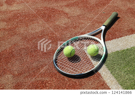 The main attributes of big tennis, racket and ball. 124141866