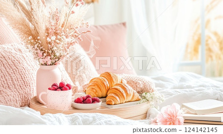 Cozy breakfast setting with croissants, raspberries, and flowers in a softly lit bedroom Cozy breakfast setting with croissants, raspberries, and flowers in a softly lit bedroom 124142145