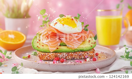 Breakfast toast with salmon, avocado, and poached egg served with juice in a cozy setting Breakfast toast with salmon, avocado, and poached egg served with juice in a cozy setting 124142169