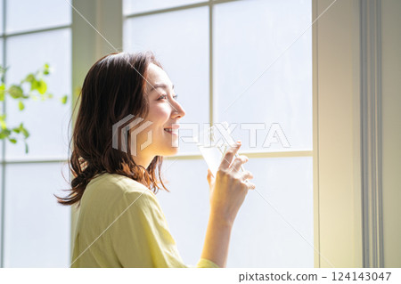 A woman drinking water 124143047