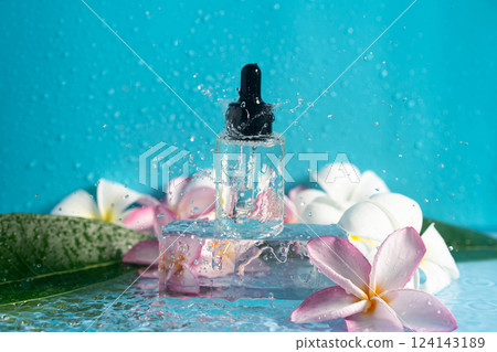 Moisturizing serum cools on ice, capturing water spills and enhancing plumeria beauty. Moisturizing serum cools on ice, capturing water spills and enhancing plumeria beauty. 124143189