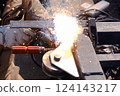 Welding the lower wheel of a steel gate 01 124143217