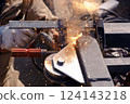 Welding the lower wheel of a steel gate 02 124143218