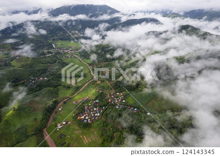 Landscape of Morning Mist with Mountain Layer. mountain ridge and clouds in rural jungle bush forest Landscape of Morning Mist with Mountain Layer. mountain ridge and clouds in rural jungle bush forest 124143345