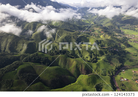 Landscape of Morning Mist with Mountain Layer. mountain ridge and clouds in rural jungle bush forest Landscape of Morning Mist with Mountain Layer. mountain ridge and clouds in rural jungle bush forest 124143373