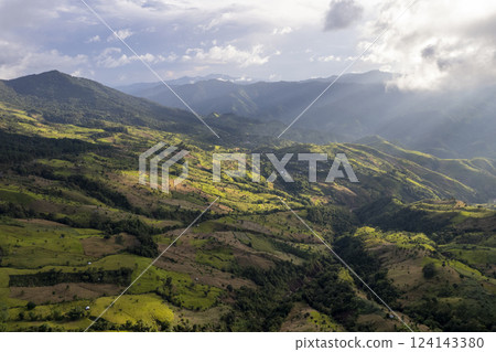Landscape of Morning Mist with Mountain Layer. mountain ridge and clouds in rural jungle bush forest 124143380