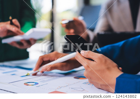 business people in meeting discussing plans together business people in meeting discussing plans together 124143802