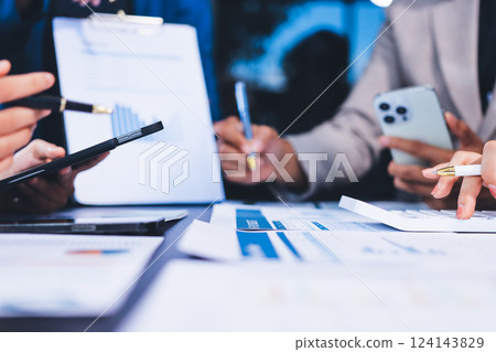 Business Team Analyzing Financial Data in Modern Office 124143829