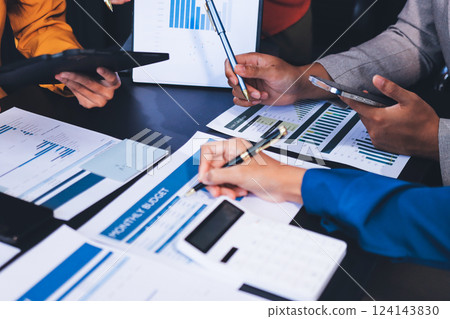 Business Team Analyzing Financial Data in Modern Office 124143830