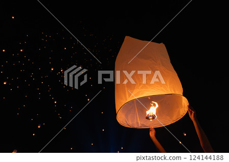Tourist floating sky lanterns in Loy Krathong festival , Chiang Mai ,Thailand. 124144188