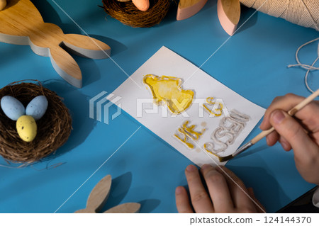 Painting Easter angel CHRIST IS RISEN phrase Gift Easter idea. Do it yourself instruction postcard eco-friendly decoration. Making handmade art presents children's diy projects. Spring holiday family 124144370