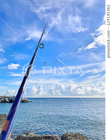 Summer sea fishing, sandy beach, coastline 124145362