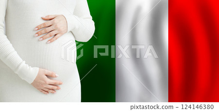 Pregnant woman belly against Italian flag background. Demographics and pregnancy in Italy concept 124146380