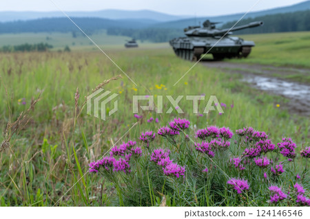 blurred tanks in the field with purple flowers 124146546