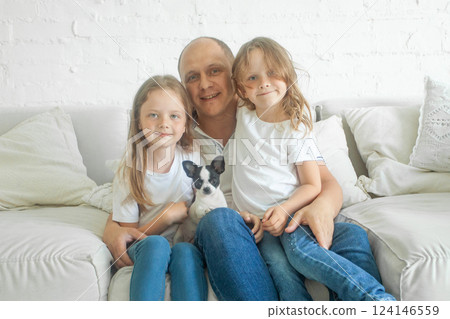Portrait of cheerful family. Father and daughters indoor Portrait of cheerful family. Father and daughters indoor 124146559