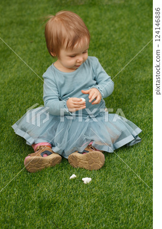 Adorable little child girl outdoors. Childhood 124146886