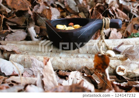 Eating nuts with a kuksa Eating nuts with a kuksa 124147232