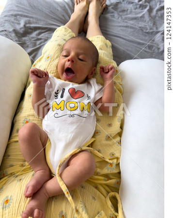 Cute Baby Yawning in I Love Mom Onesie 124147353
