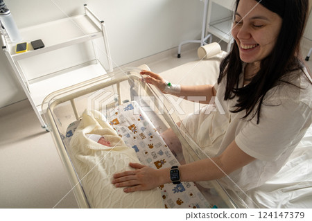 Mother with Newborn in Hospital Room 124147379