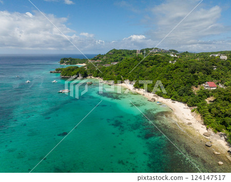 Drone view of clear waters and Hagdan Beach with white sands and rocks. Boracay, Philippines. 124147517
