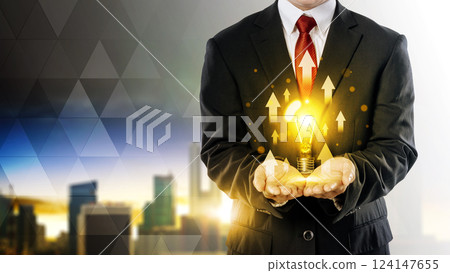 Businessman showing bright light bulb with upward arrows on his hand. Business, idea, brainstorming, innovation, and success concept Businessman showing bright light bulb with upward arrows on his hand. Business, idea, brainstorming, innovation, and success concept 124147655